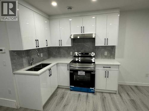 1612 Rangeview Drive Se, Calgary, AB - Indoor Photo Showing Kitchen With Double Sink