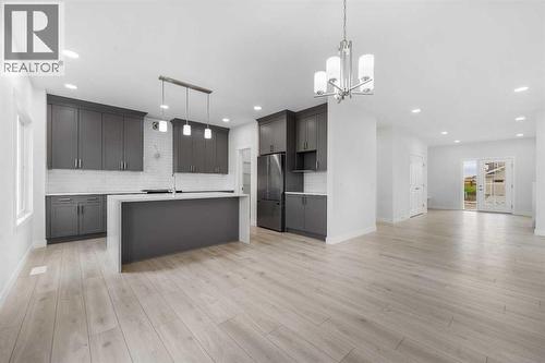 142 Sunstone Way, Balzac, AB - Indoor Photo Showing Kitchen With Upgraded Kitchen