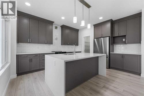 142 Sunstone Way, Balzac, AB - Indoor Photo Showing Kitchen With Upgraded Kitchen