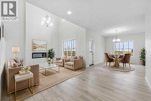 Virtually Staged - 142 Sunstone Way, Balzac, AB - Indoor Photo Showing Living Room