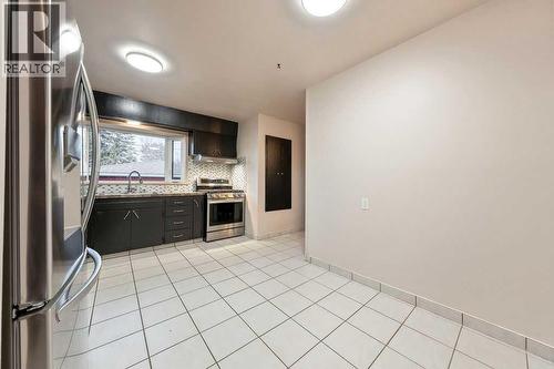 9136 Allison Drive Se, Calgary, AB - Indoor Photo Showing Kitchen