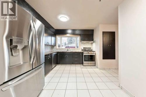 9136 Allison Drive Se, Calgary, AB - Indoor Photo Showing Kitchen
