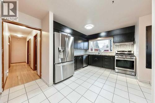 9136 Allison Drive Se, Calgary, AB - Indoor Photo Showing Kitchen