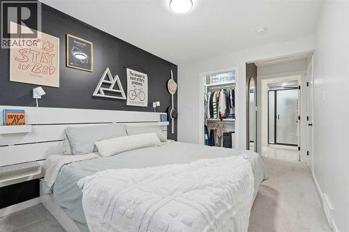 Primary Bedroom with walk in closet and 5pc ensuite - 711 101 Avenue Sw, Calgary, AB - Indoor Photo Showing Bedroom