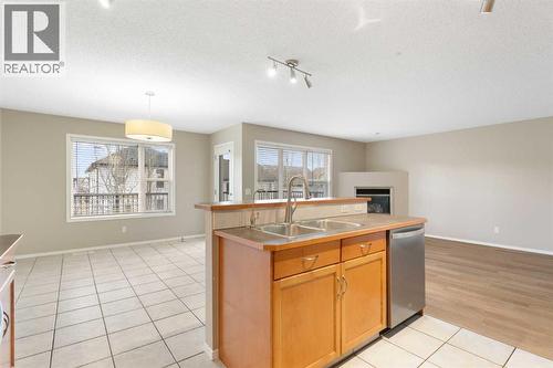 Living area from kitchen - 129 Evansbrooke Way Nw, Calgary, AB - Indoor Photo Showing Kitchen With Double Sink