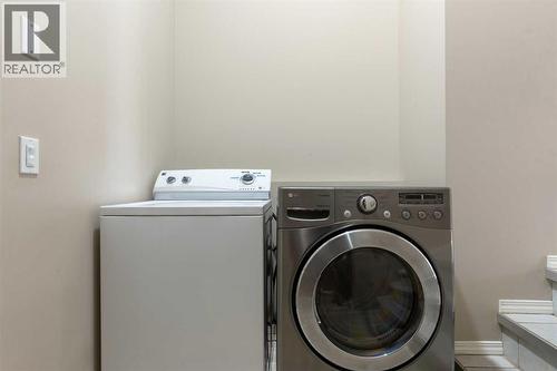 Main floor laundry - 129 Evansbrooke Way Nw, Calgary, AB - Indoor Photo Showing Laundry Room