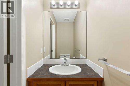2-pice powder room with vanity - 129 Evansbrooke Way Nw, Calgary, AB - Indoor Photo Showing Bathroom