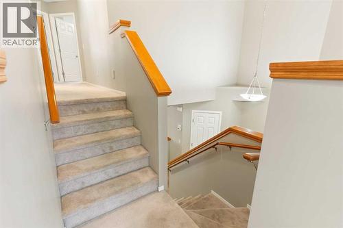 Upper level stairs - 129 Evansbrooke Way Nw, Calgary, AB - Indoor Photo Showing Other Room