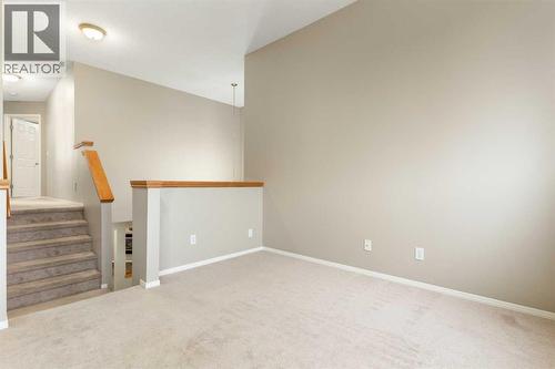 Bonus room to bedrooms - 129 Evansbrooke Way Nw, Calgary, AB - Indoor Photo Showing Other Room
