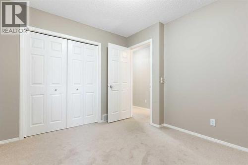 Bedroom 3 - 129 Evansbrooke Way Nw, Calgary, AB - Indoor Photo Showing Other Room
