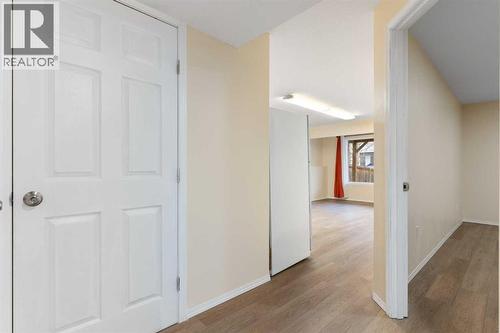 Lower-level hallway, door to utility room - 129 Evansbrooke Way Nw, Calgary, AB - Indoor Photo Showing Other Room