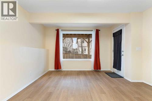 Lower-level living/recreation room, door to patio - 129 Evansbrooke Way Nw, Calgary, AB - Indoor Photo Showing Other Room