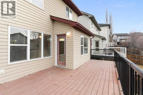 Balcony, composite decking, metal railing, south exposure - 129 Evansbrooke Way Nw, Calgary, AB - Outdoor With Deck Patio Veranda With Exterior