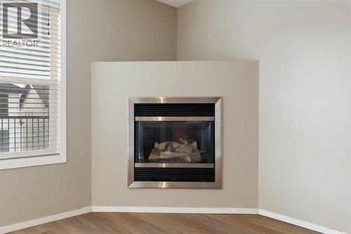 Corner gas fireplace - 129 Evansbrooke Way Nw, Calgary, AB - Indoor With Fireplace