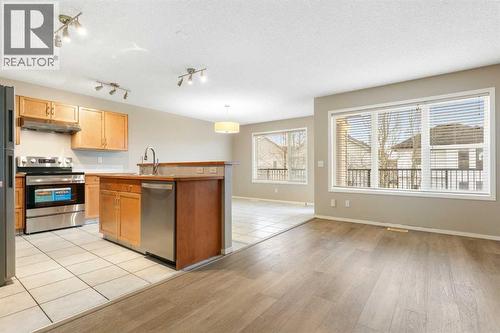 Open bright living area - 129 Evansbrooke Way Nw, Calgary, AB - Indoor Photo Showing Kitchen