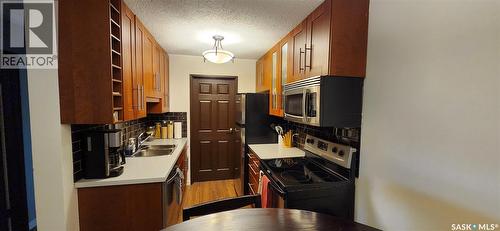 206 802A Kingsmere Boulevard, Saskatoon, SK - Indoor Photo Showing Kitchen With Double Sink