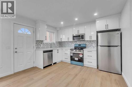 63 Penworth Close Se, Calgary, AB - Indoor Photo Showing Kitchen With Stainless Steel Kitchen With Upgraded Kitchen