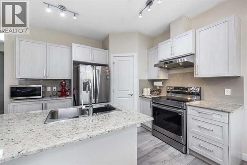 405 Sage Hill Grove Nw, Calgary, AB - Indoor Photo Showing Kitchen With Stainless Steel Kitchen With Double Sink With Upgraded Kitchen