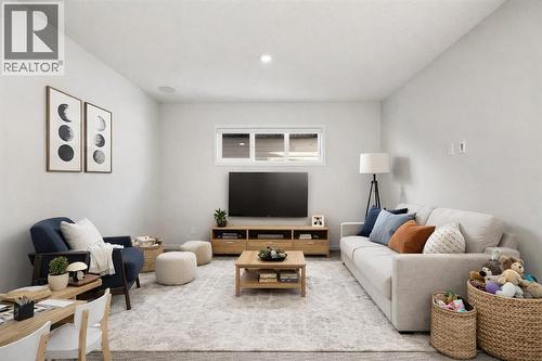 This photo has been virtually staged - 110 Wolf Creek Rise Se, Calgary, AB - Indoor Photo Showing Living Room