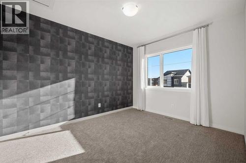 110 Wolf Creek Rise Se, Calgary, AB - Indoor Photo Showing Other Room
