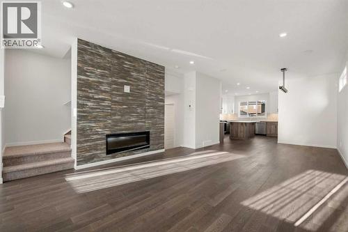 110 Wolf Creek Rise Se, Calgary, AB - Indoor Photo Showing Living Room With Fireplace