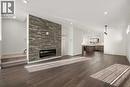 110 Wolf Creek Rise Se, Calgary, AB  - Indoor Photo Showing Living Room With Fireplace 