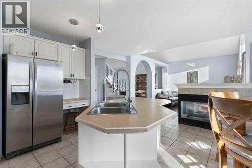 202 Schooner Close Nw, Calgary, AB - Indoor Photo Showing Kitchen With Stainless Steel Kitchen With Double Sink