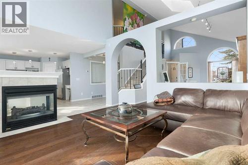 202 Schooner Close Nw, Calgary, AB - Indoor Photo Showing Living Room With Fireplace