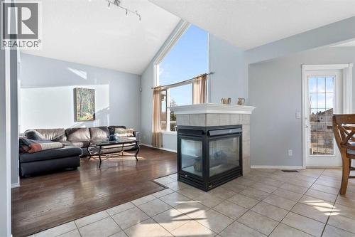 202 Schooner Close Nw, Calgary, AB - Indoor Photo Showing Living Room With Fireplace