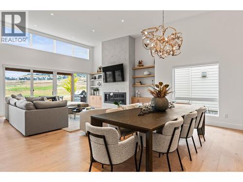 105 Predator Ridge Drive Unit# 22, Vernon, BC - Indoor Photo Showing Dining Room With Fireplace