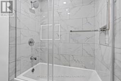 Glassed in shower. - 