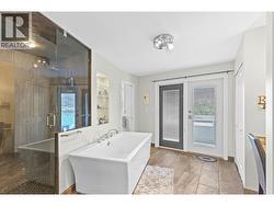 Heated tile floor, oversized soaker tub, and walk in shower - 