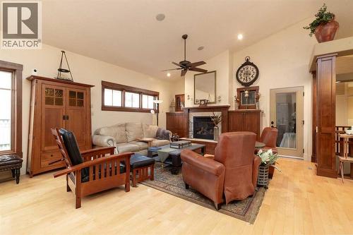 1003 Canyon Boulevard W, Lethbridge, AB - Indoor Photo Showing Living Room With Fireplace