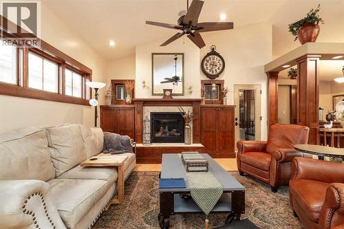 1003 Canyon Boulevard W, Lethbridge, AB - Indoor Photo Showing Living Room With Fireplace
