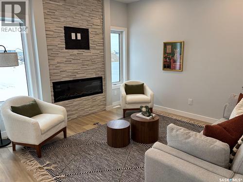 335 Asokan Bend, Saskatoon, SK - Indoor Photo Showing Living Room With Fireplace
