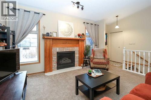 31 Armitage Close, Red Deer, AB - Indoor Photo Showing Living Room With Fireplace
