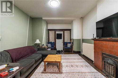 25 West Avenue S, Hamilton, ON - Indoor Photo Showing Living Room With Fireplace