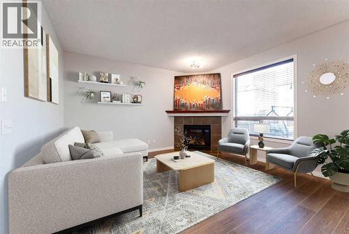 10 Everglen Crescent Sw, Calgary, AB - Indoor Photo Showing Living Room With Fireplace