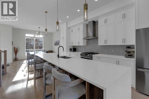 7712 36 Avenue Nw, Calgary, AB - Indoor Photo Showing Kitchen With Stainless Steel Kitchen With Double Sink With Upgraded Kitchen