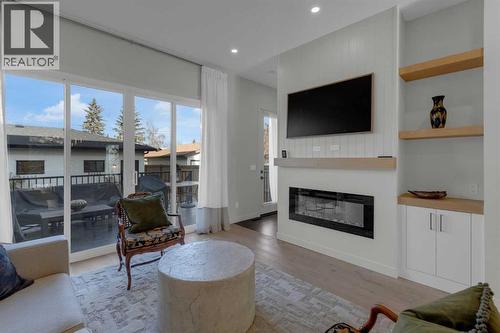 7712 36 Avenue Nw, Calgary, AB - Indoor Photo Showing Living Room With Fireplace