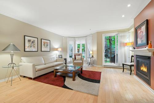 Salon - 2-38 Av. Ste-Hélène, Saint-Lambert, QC - Indoor Photo Showing Living Room With Fireplace