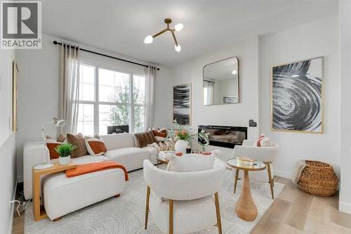 240 Layton Link Se, Airdrie, AB - Indoor Photo Showing Living Room With Fireplace
