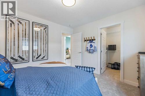 65 Emberside Grove, Cochrane, AB - Indoor Photo Showing Bedroom