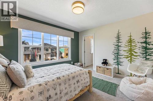 65 Emberside Grove, Cochrane, AB - Indoor Photo Showing Bedroom
