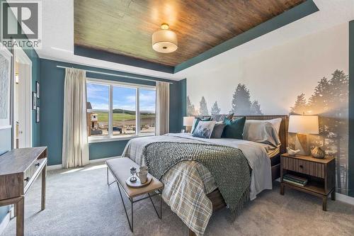 65 Emberside Grove, Cochrane, AB - Indoor Photo Showing Bedroom