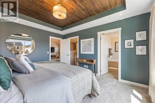 65 Emberside Grove, Cochrane, AB - Indoor Photo Showing Bedroom
