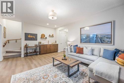 65 Emberside Grove, Cochrane, AB - Indoor Photo Showing Living Room