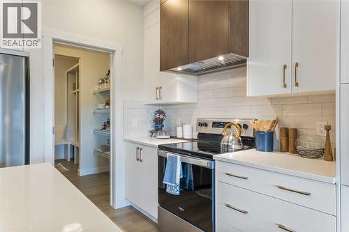 65 Emberside Grove, Cochrane, AB - Indoor Photo Showing Kitchen With Upgraded Kitchen