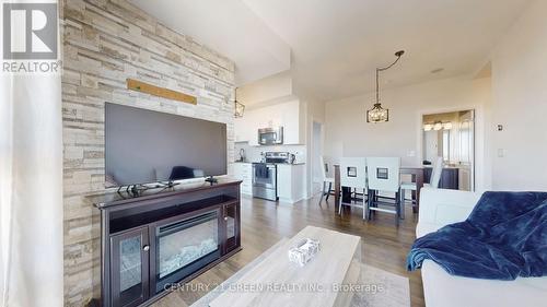 1106 - 45 Yorkland Boulevard, Brampton, ON - Indoor Photo Showing Living Room With Fireplace