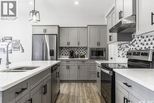 343 Stilling Manor, Saskatoon, SK - Indoor Photo Showing Kitchen With Stainless Steel Kitchen With Double Sink With Upgraded Kitchen